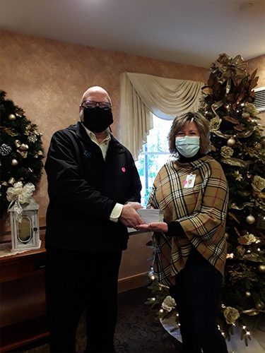 Blog - Jim Rugh at Shenango on the Green Handing a Woman Cards